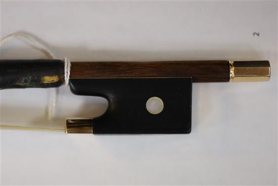 A German gold mounted violin bow, 19th century, length 74cm, weight 59g.